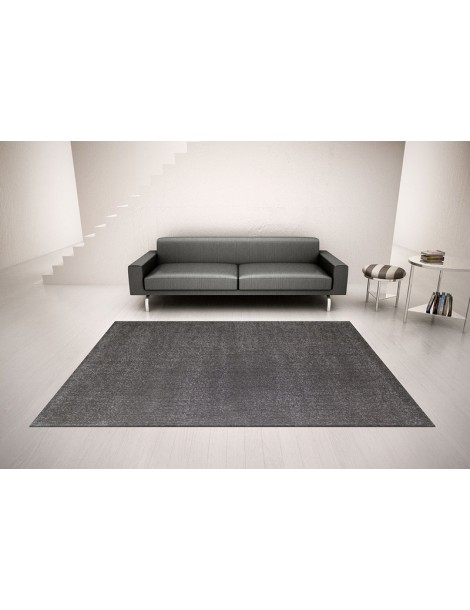 Ambientazione del tappeto minimal moderno a tinta piatta color grigio